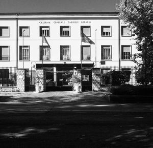 Road by buildings in city