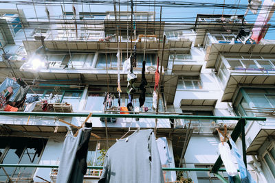 Low angle view of clothes hanging on building