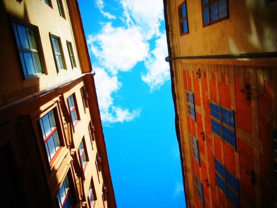 architecture, building exterior, built structure, low angle view, window, sky, residential structure, building, residential building, blue, city, balcony, cloud, day, house, outdoors, no people, apartment, cloud - sky, directly below