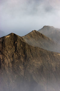 A beautiful little mountains covered by fogs in the morning