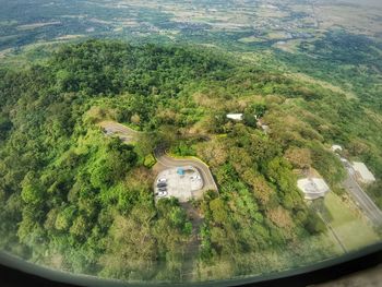 High angle view of trees seen through car window