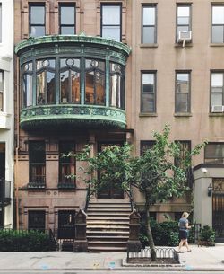 Man in front of building