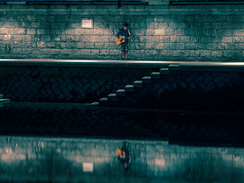 Man running on staircase at night