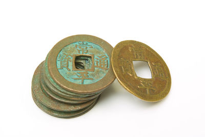 Close-up of coins on white background