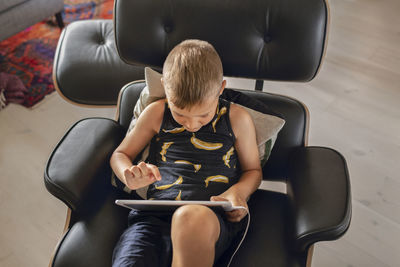 Boy using digital tablet