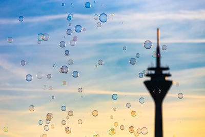 Close-up of bubbles against sky during sunset