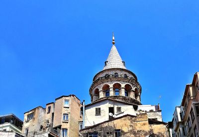 Low angle view of buildings against blue sky