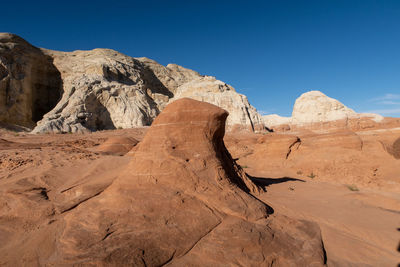 Landscape of brown and white stone formations at the toadstools in grand staircase escalante in utah