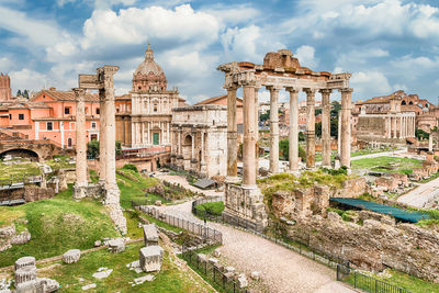 View of roman forum against cloudy sky