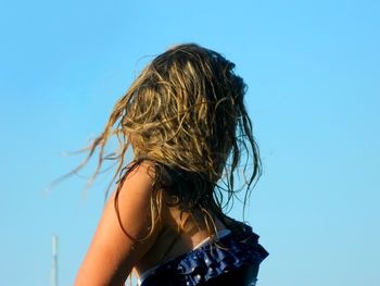 Mid adult woman against clear sky