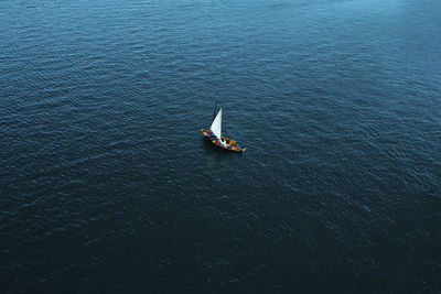 Overhead view of sailboat on sea