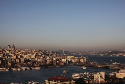 High angle view of city by sea against sky