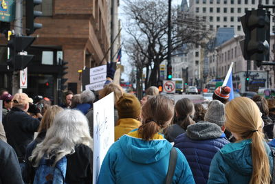 Crowd on street in city