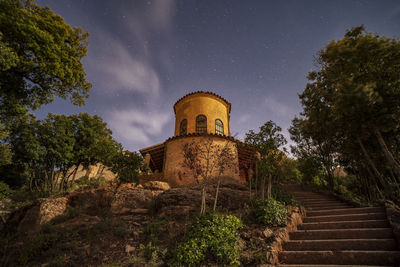 Low angle view of old building against sky at night