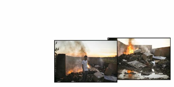 Bonfire on wooden structure against clear sky