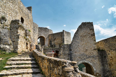 Low angle view of old ruins against sky