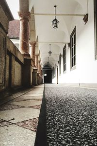 Empty walkway in front of building