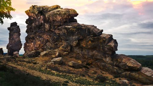 Rock formation on land against sky