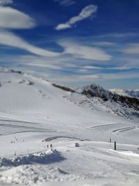 Scenic view of beach against sky during winter