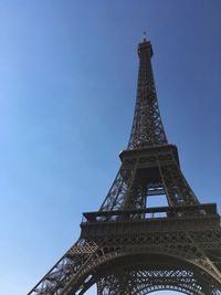 Low angle view of tower against blue sky