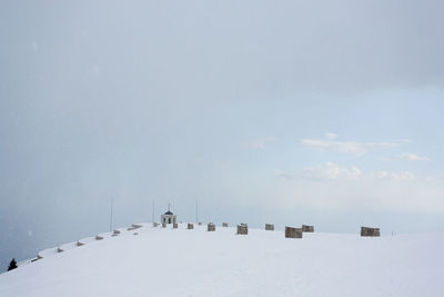 Scenic view of snow covered landscape against sky