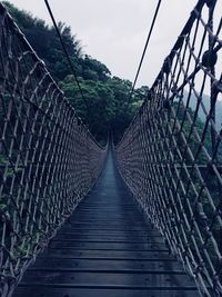 View of footbridge against sky