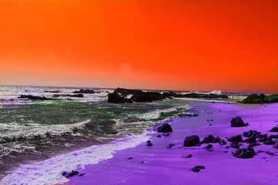 Scenic view of sea against clear sky during sunset