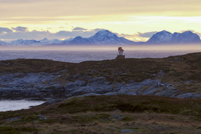 Scenic view of mountains and sea against sky