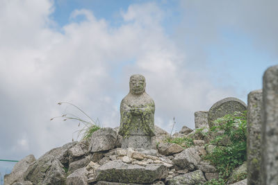 Low angle view of statue against sky