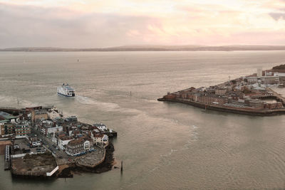 Aerial view of a car ferry leaving the harbour of portsmouth, hampshire, southern england