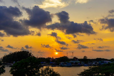 Scenic view of river against orange sky