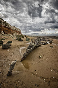 Scenic view of sea against cloudy sky