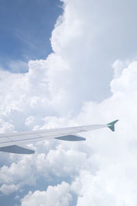 Low angle view of airplane flying in sky