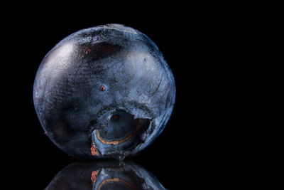 Close-up of statue against black background