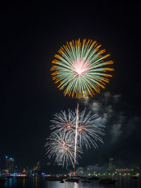 Firework display in pattaya city against sky at night, pattaya fireworks festival