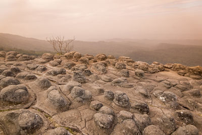 Scenic view of arid landscape against sky