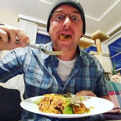 Close-up of man eating food