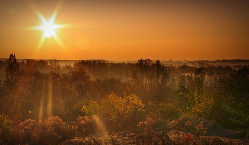 Scenic view of landscape against sky during sunset