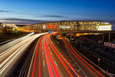 High angle view of light trails on road at night