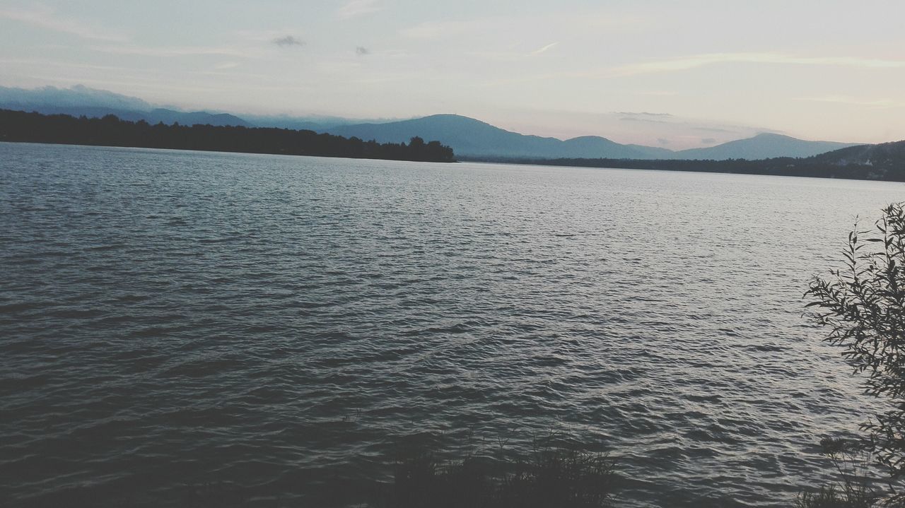 nature, scenics, tranquility, beauty in nature, tranquil scene, mountain, no people, water, rippled, sunset, idyllic, silhouette, sky, lake, outdoors, day