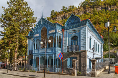 Exterior of building by street against sky