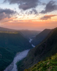 Scenic view of mountains against sky during sunset