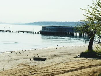 View of built structure by sea