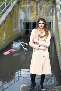 Full length of woman standing in snow