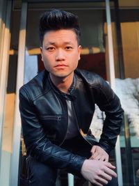 Portrait of young man standing outdoors