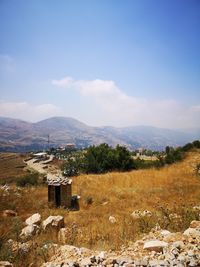 Scenic view of landscape and mountains against sky