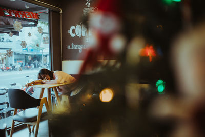 Reflection of woman in restaurant