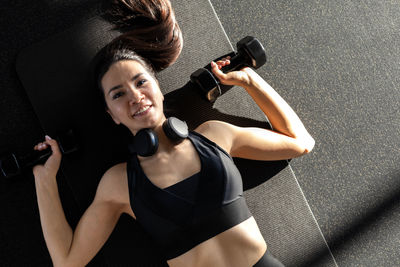 Young woman exercising in gym