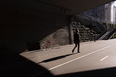 Full length of man on road in city
