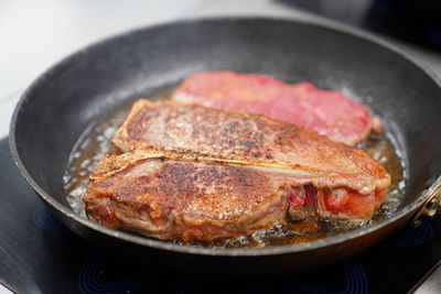 High angle view of meat in cooking pan